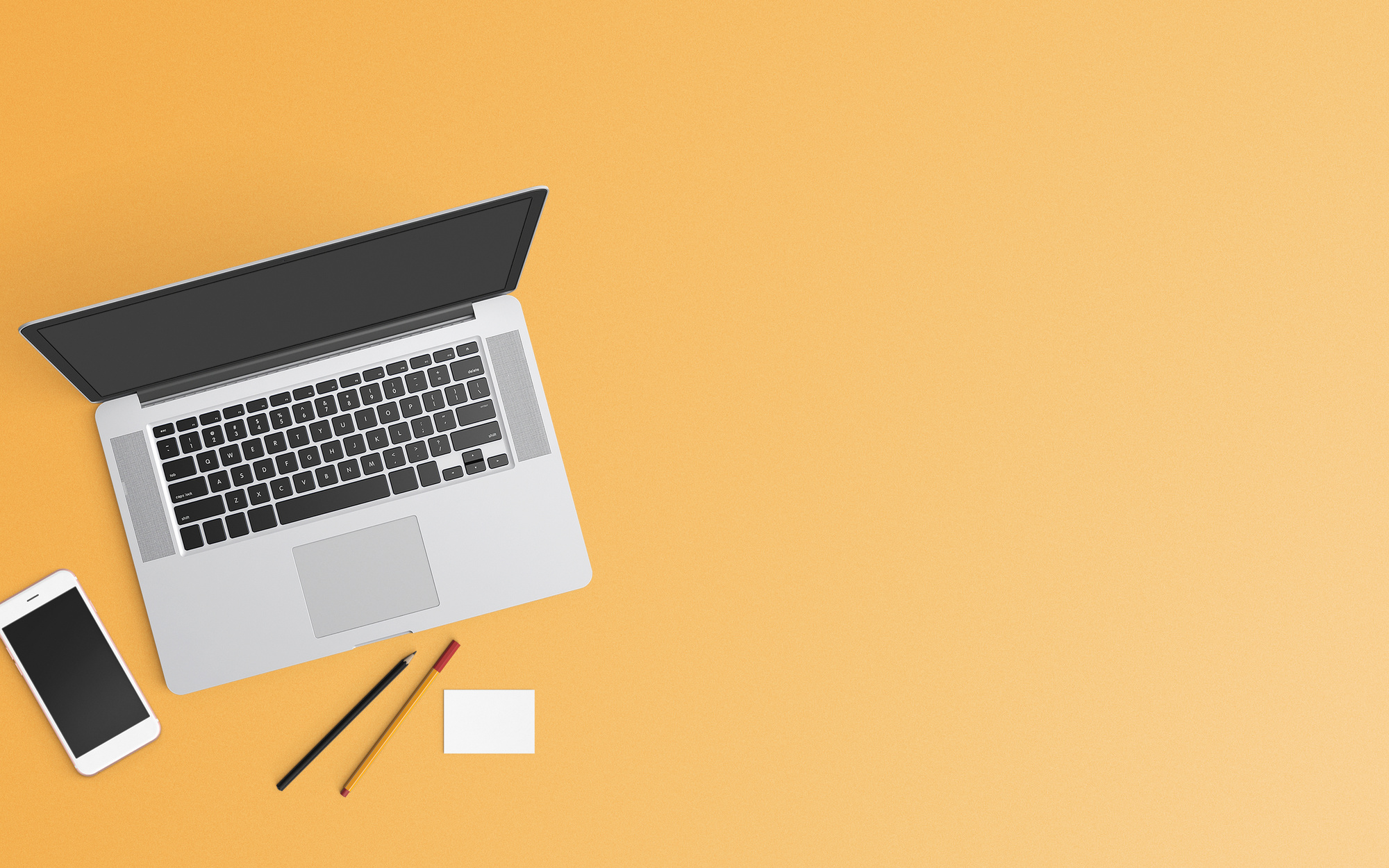 Laptop and Smartphone on Pastel Orange Background